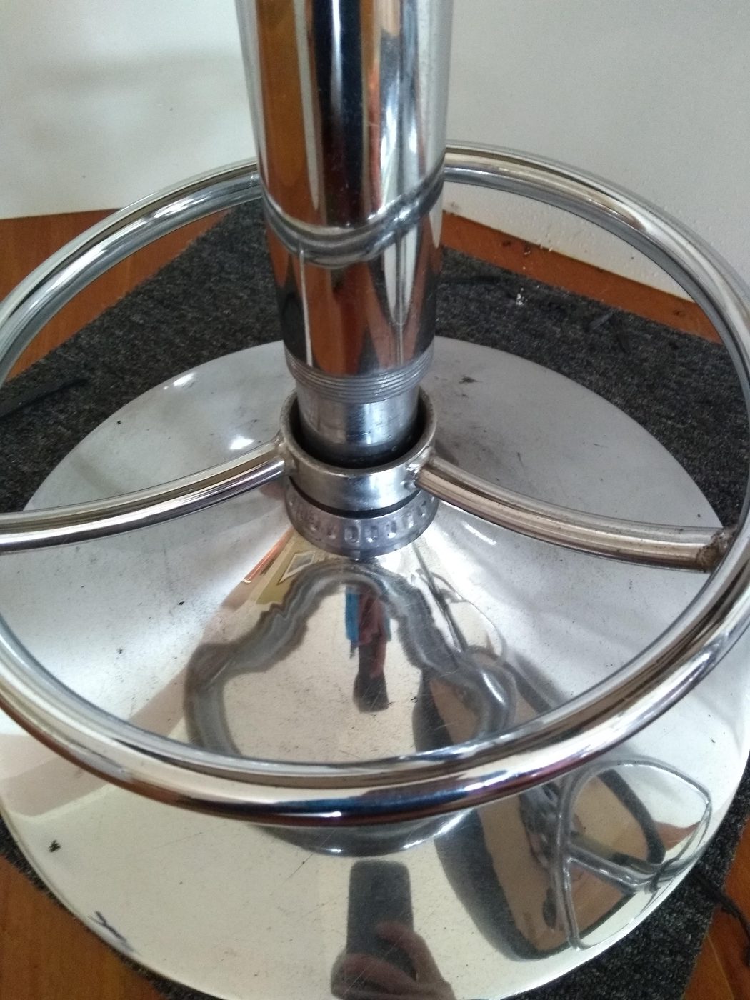 Polished chrome bar stool base after cleaning