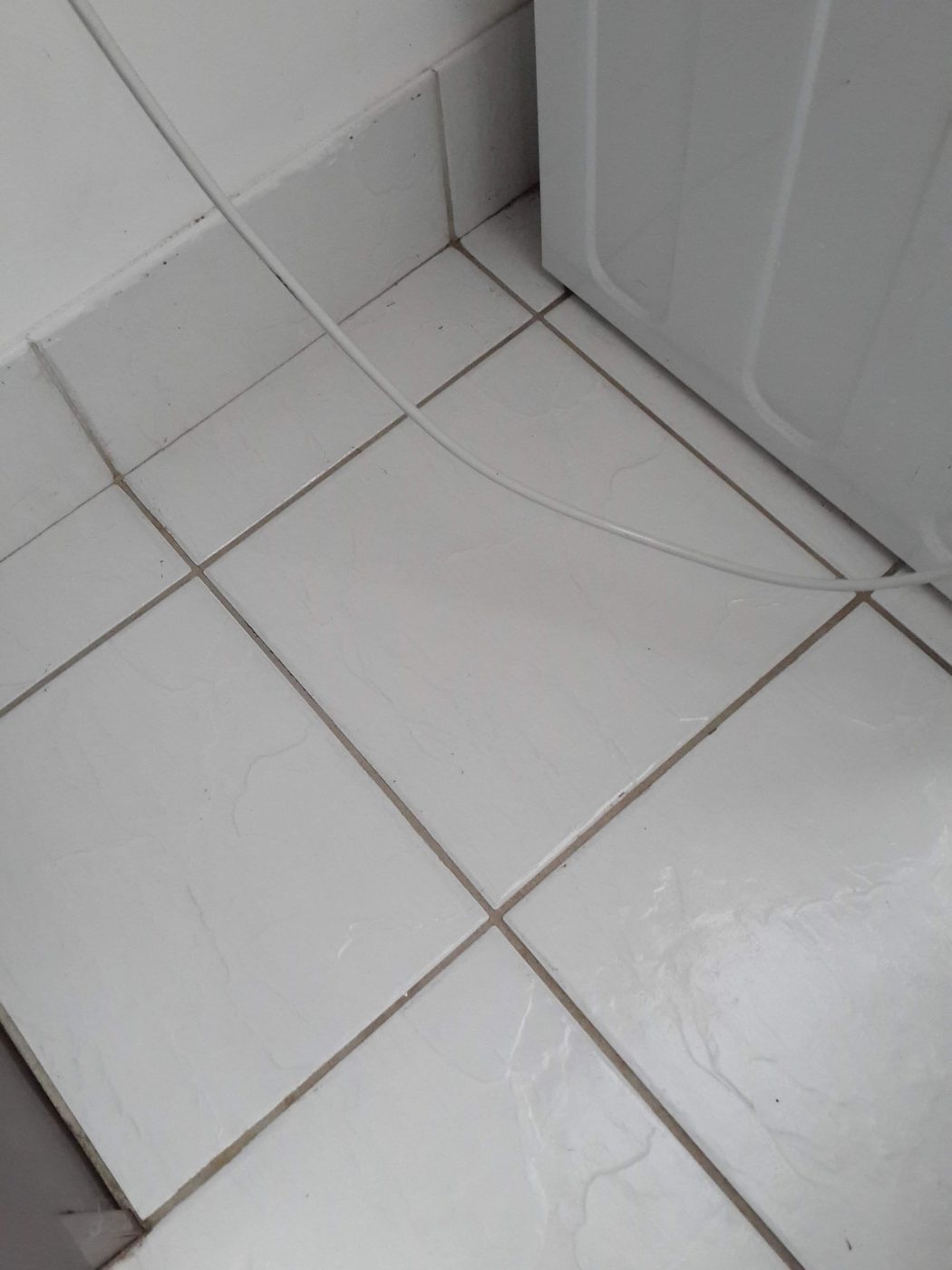 Clean white floor tiles after cleaning